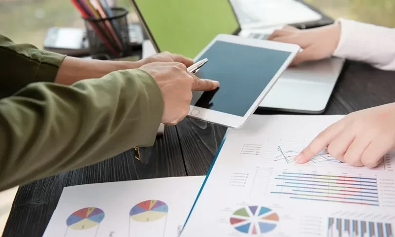 business-team-meeting-discuss-statistical-data-presented-form-digital-graphs-charts